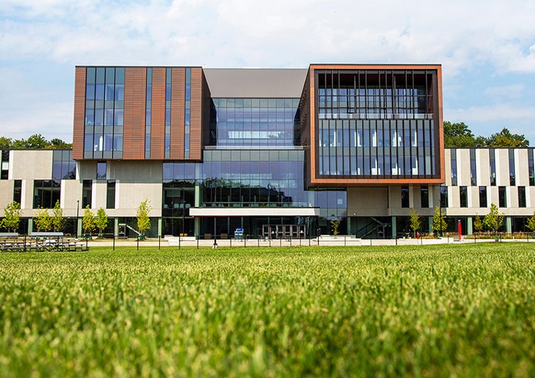 The Maanjiwe nendamowinan building looks like a series of interlocking boxes with plenty of windows