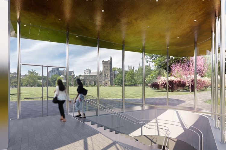 Two students climb a staircase and emerge into a glass pavilion overlooking Front Campus.