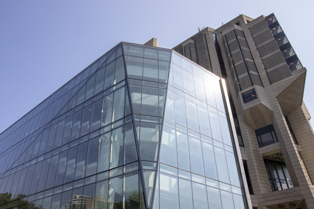 A four-storey building, completely walled in glass, projects from the side of Robarts Library.