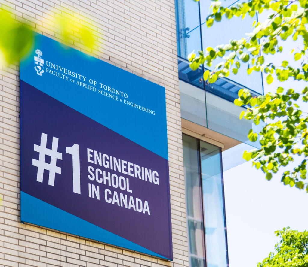 A sign on the side of a U of T building reads: #1 engineering school in Canada.