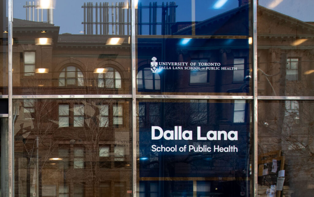 A sign in a big glass window reads: Dalla Lana School of Public Health