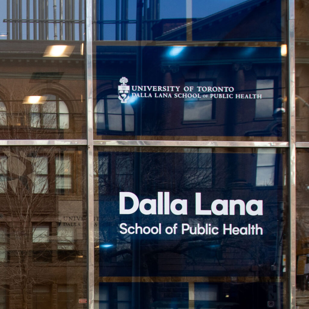 A sign in a big glass window reads: Dalla Lana School of Public Health