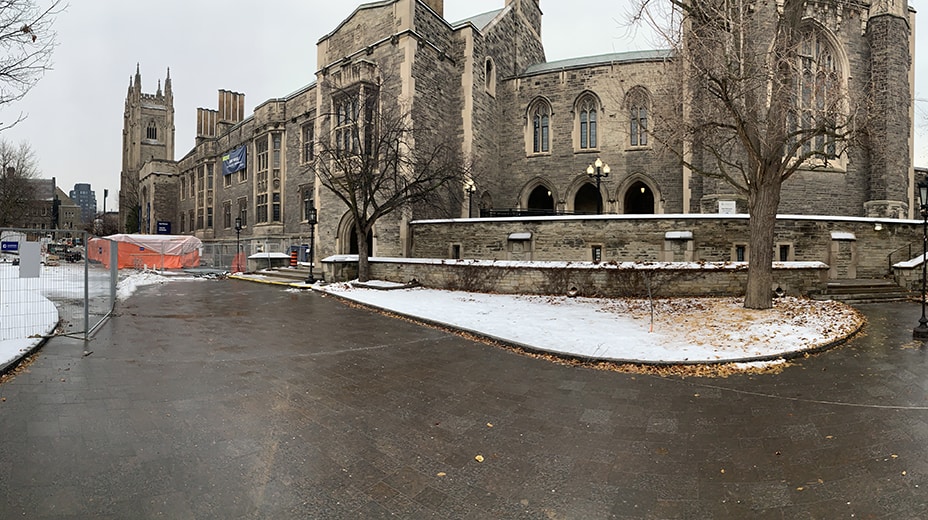 Snow dusts a beautiful pavement of differently shaded granite paving stones at the east end of Hart House.