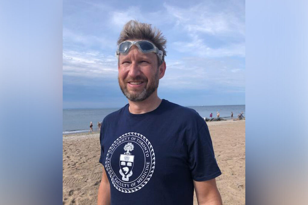 Sean Nuttall completes record-breaking Lake Ontario swim to raise money for U of T brain research.
