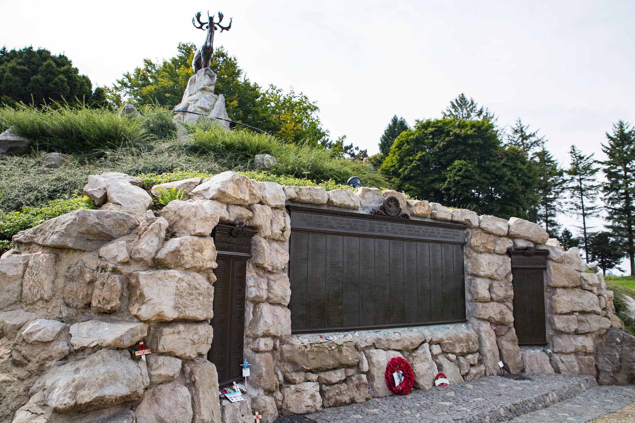 The Newfoundland memorial at Beaumont Hamel: a green hill, hundreds of names engraved in metal, and a statue of a caribou.
