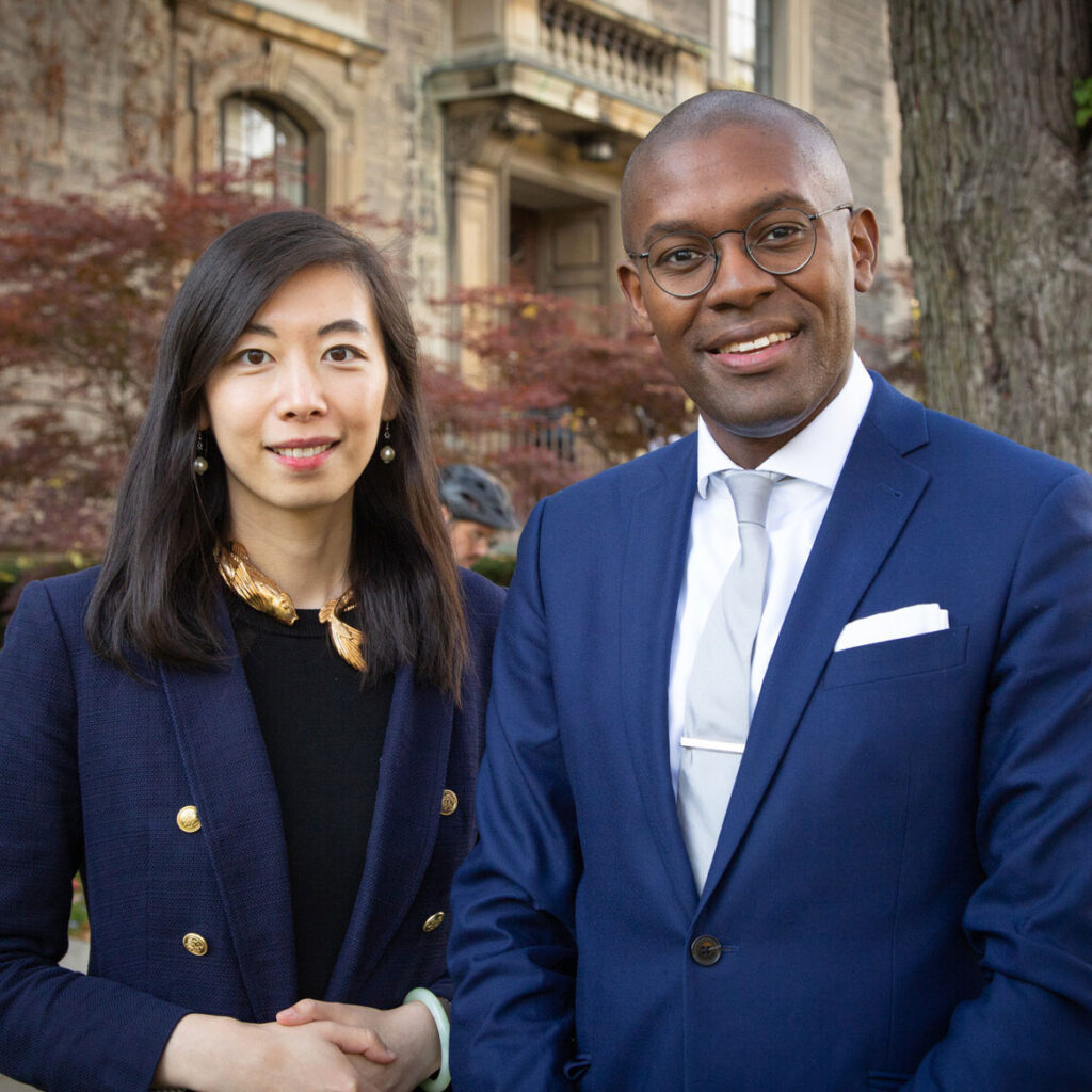 Stephanie Zhou and Colin Lynch smiling together outdoors.