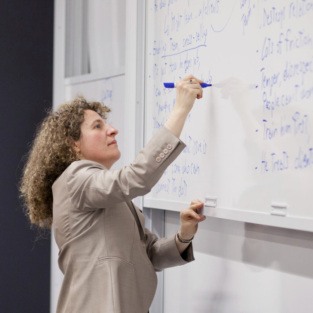 Professor Tiziana Casciaro writing on a white board