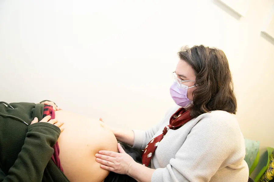 Midwife Cheryllee Bourgeois treating a pregnant patient.