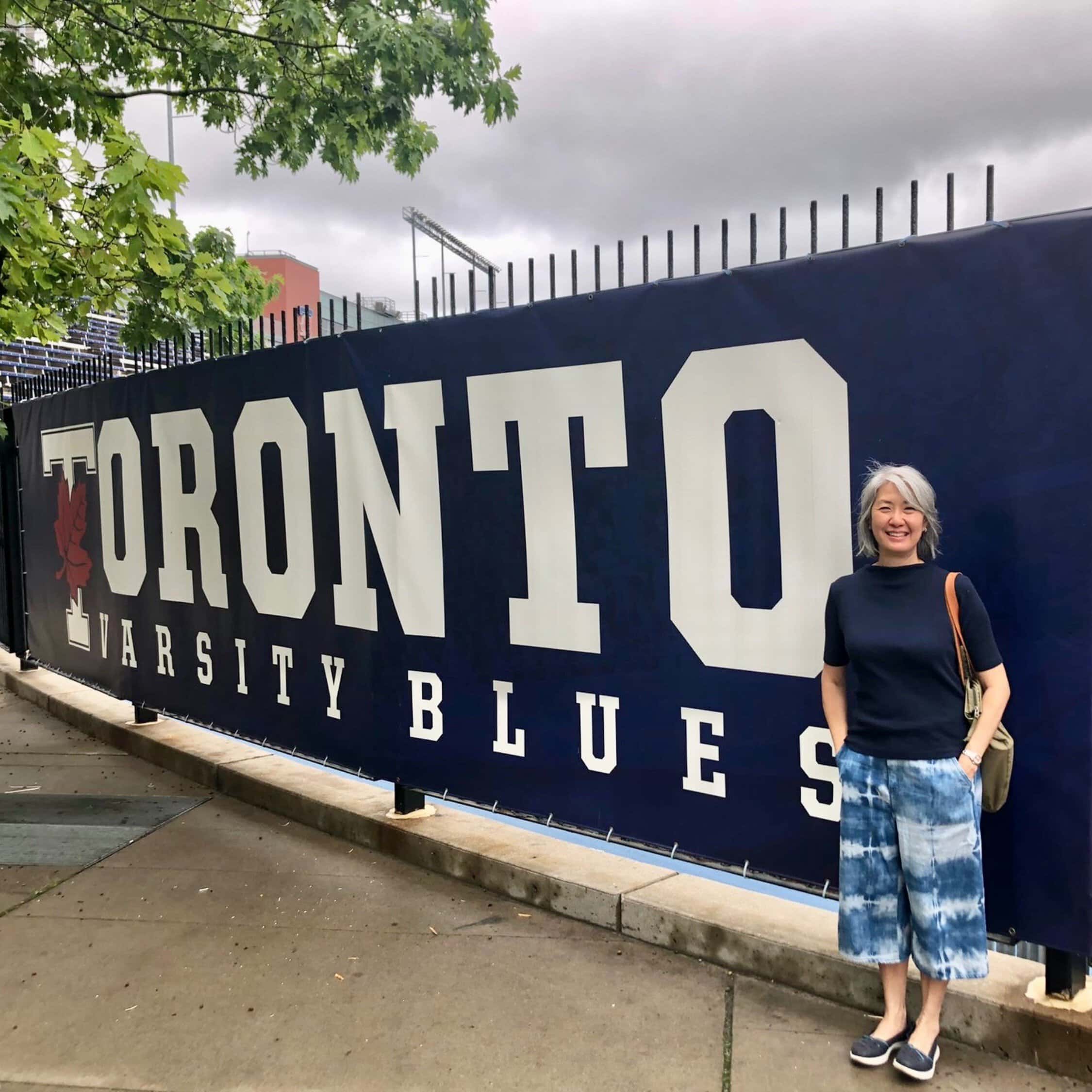 Esther Wan standing in front of Varsity Stadium