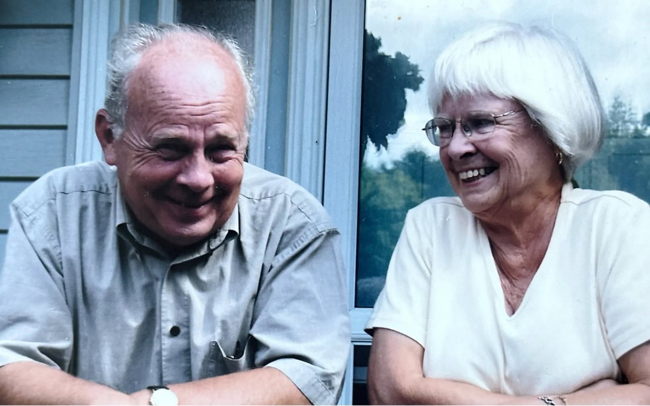 Timothy J. McGee and Bonnie McGee sitting together and smiling