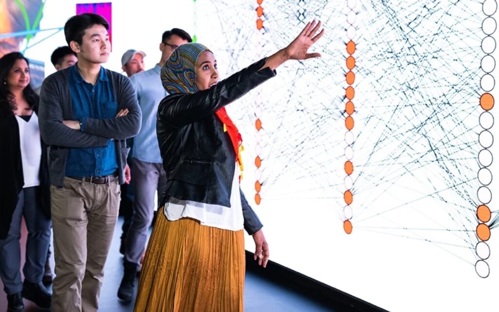 A group of people touring a science facility