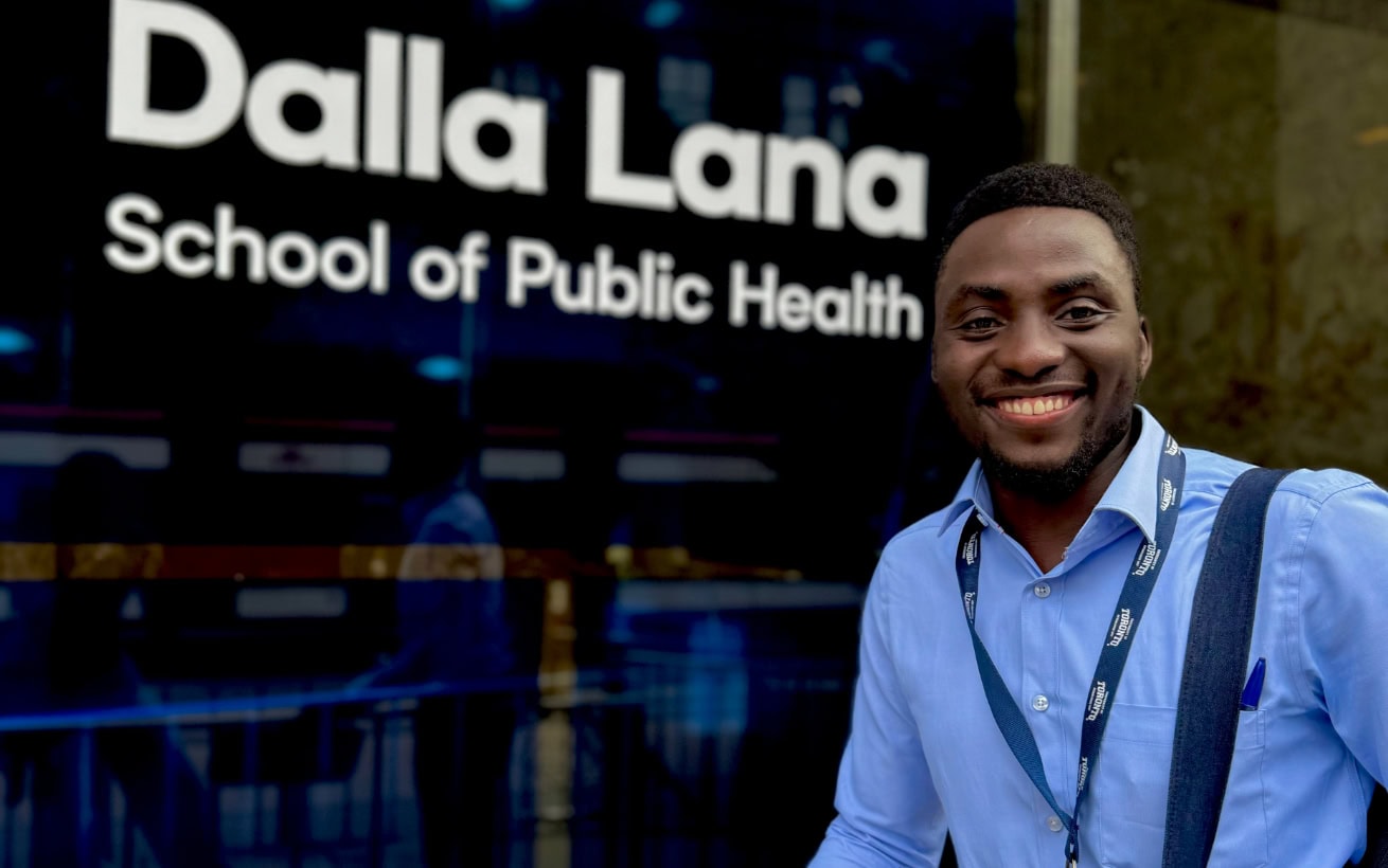 Naturinda Emmanuel posing in front of the Dalla Lana School of Public Health