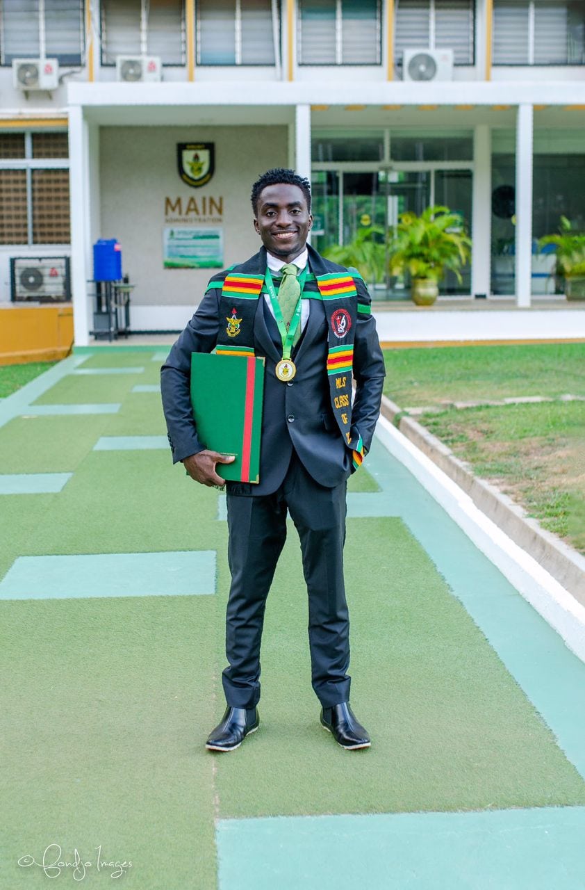 Emmanuel in his graduation attire in Ghana