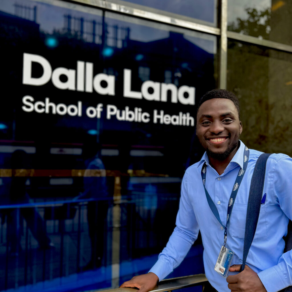 Naturinda Emmanuel posing in front of the Dalla Lana School of Public Health