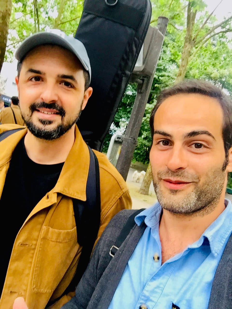 Close-up of Tony Bali and Romain Pilon outside in Paris.