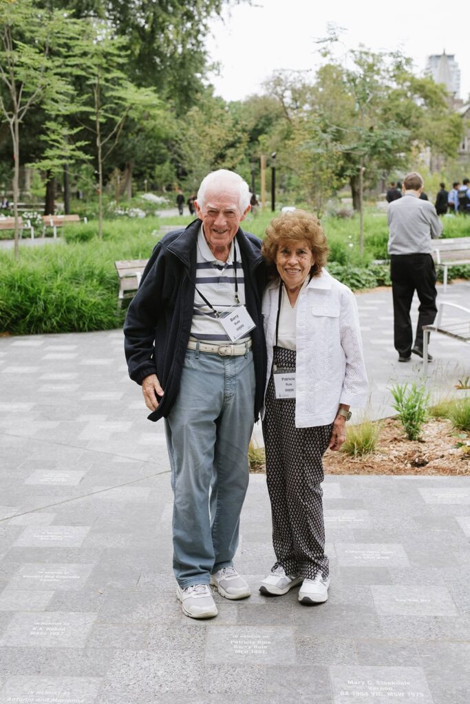 Photo of two attendees smiling together