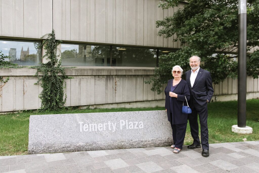 Photo of the Temerity's in front of the Temerity plaza sign