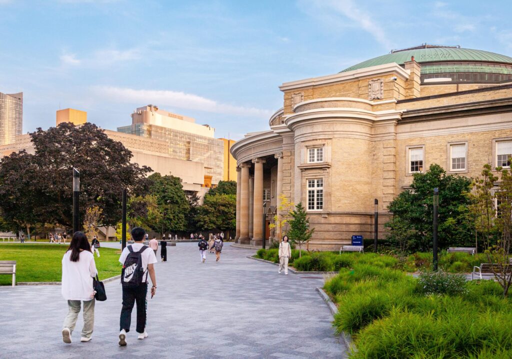 Photo of Alumni Plaza with students walking around