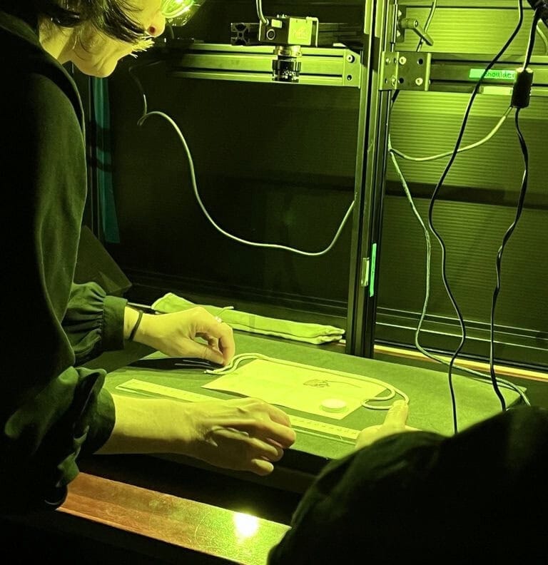 A person examining a rare book