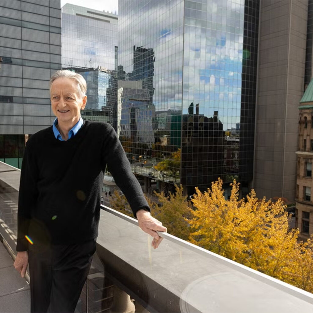 Hinton posing on a rooftop