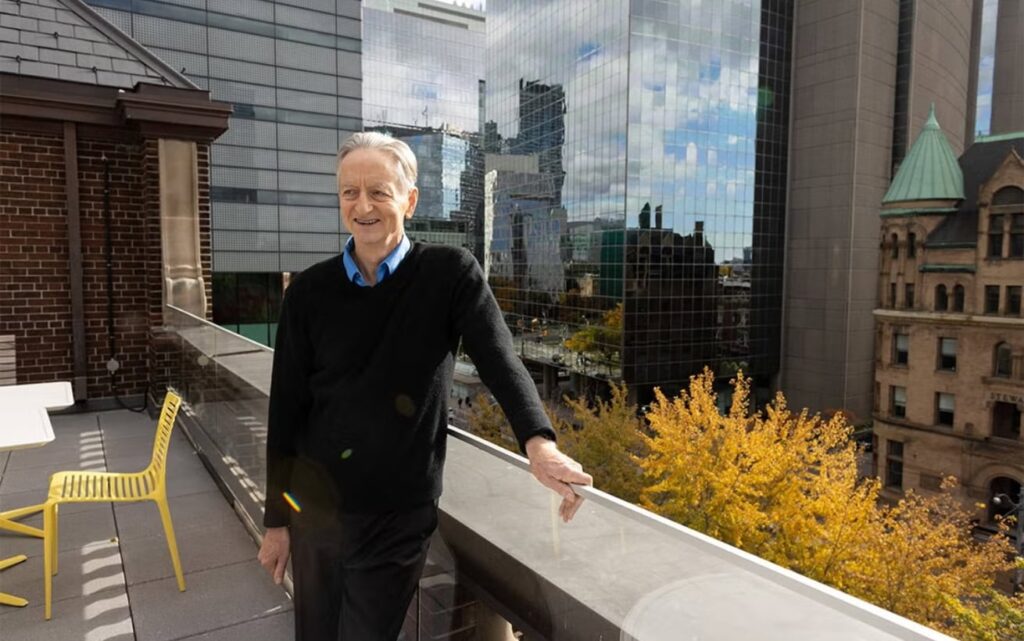 Hinton posing on a rooftop in Toronto