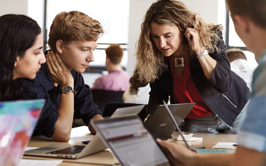 Four people at a desk