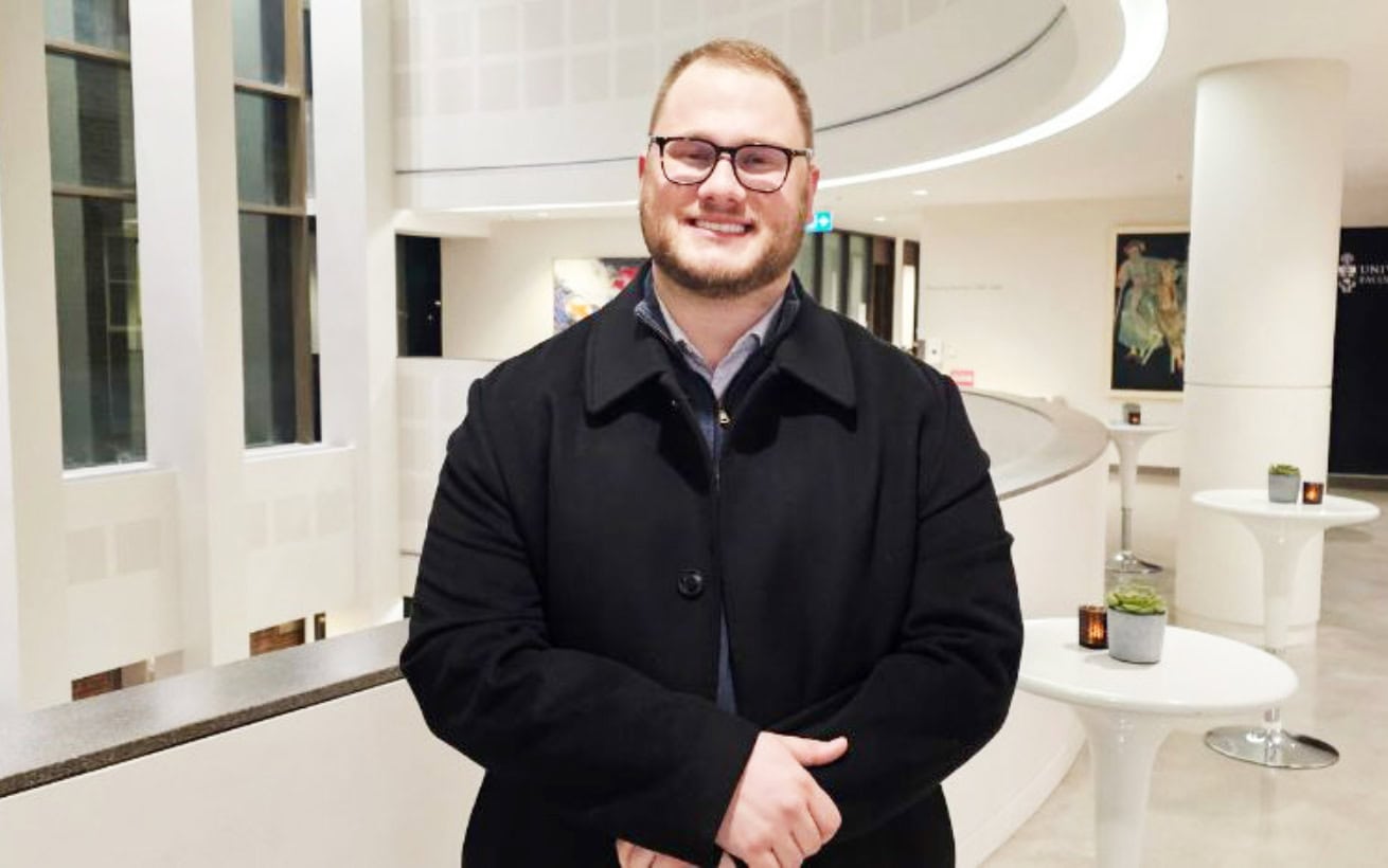 A person standing in a white building.