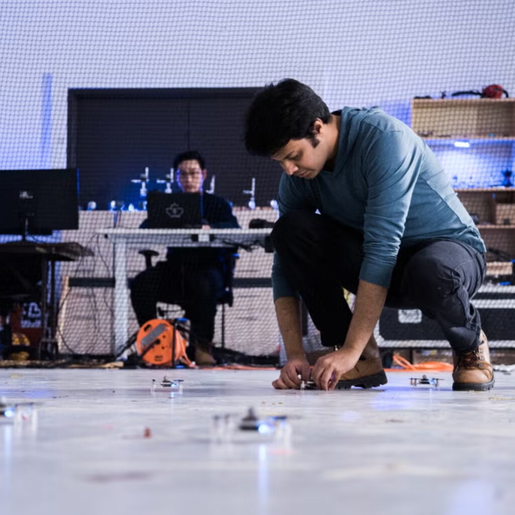 Two people in a high-tech engineering lab