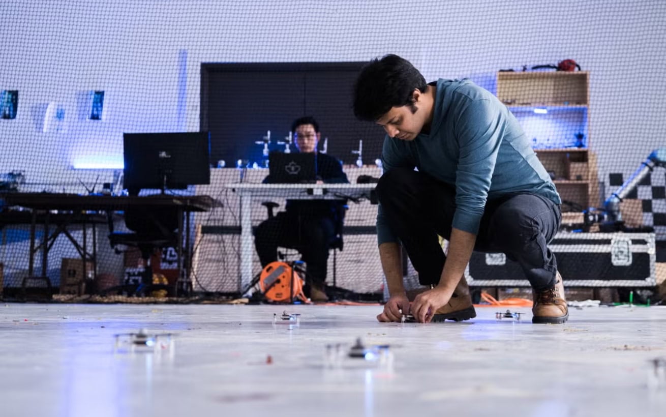 Two people in a high-tech engineering lab