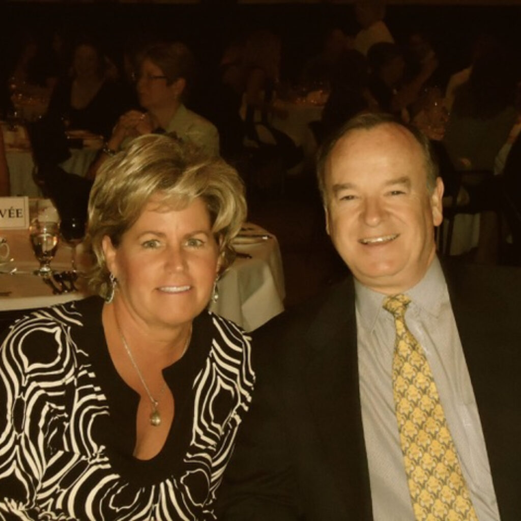 A couple seated at a banquet table