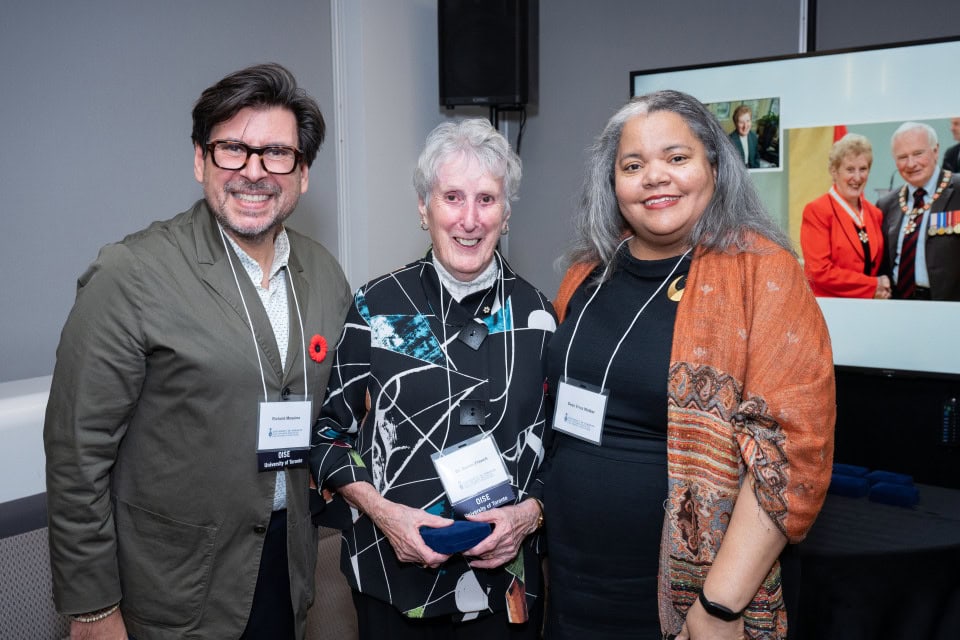 People smiling at an event