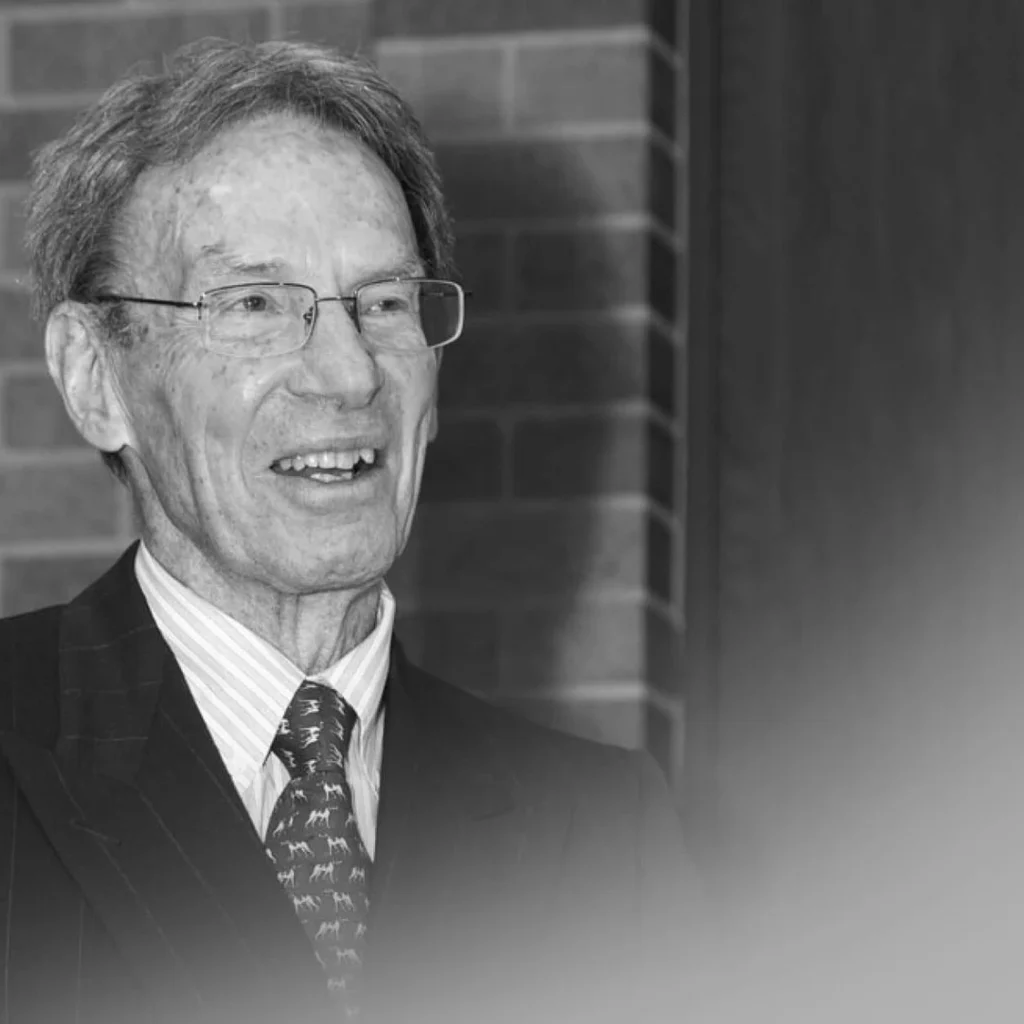 profile of man in glasses smiling