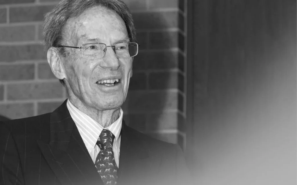 profile of man in glasses smiling